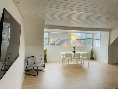 a dining room with a table and chairs at aday - Modern 3 bedrooms apartment in Svenstrup in Svenstrup