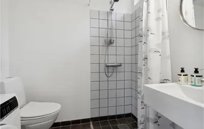 a bathroom with a shower and a toilet and a sink at 3 Bedroom Amazing Home In Fur in Fur