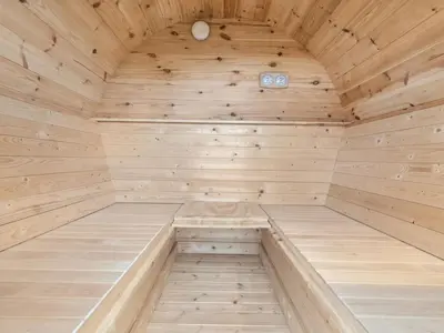 a wooden sauna with a large wooden ceiling at Holiday Home Bruni - 400m from the sea by Interhome in Frøstrup