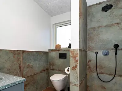a bathroom with a toilet and a shower at 5 star holiday home in Lemvig-By Traum in Lemvig
