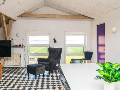 a living room with two chairs and a table at 20 person holiday home in Karby-By Traum in Karby