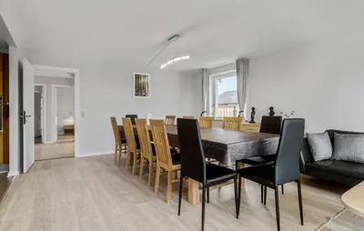 a dining room and living room with a table and chairs at Lovely Home In Vestervig With Wifi in Vestervig