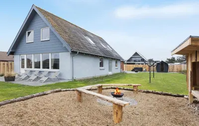 a house with a fire pit in a yard at Lovely Home In Vestervig With Wifi in Vestervig