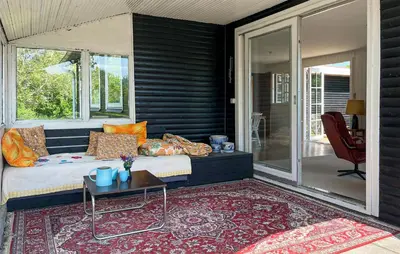 a room with a bed and a table on a patio at 3 Bedroom Gorgeous Home In Vinderup in Vinderup