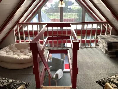 a loft bed in a room with a window at 6 person holiday home in Thisted-By Traum in Thisted