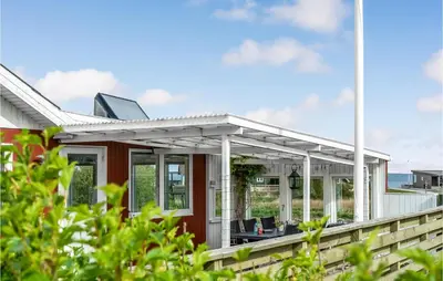 a house with a porch with a solarium at Holiday Home Vinderup 5 in Vinderup