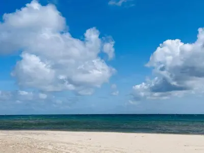 a beach with a cloudy sky and the ocean at 12 person holiday home in Roslev-By Traum in Roslev