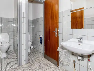 a bathroom with a sink and a toilet at 12 person holiday home in Roslev-By Traum in Roslev