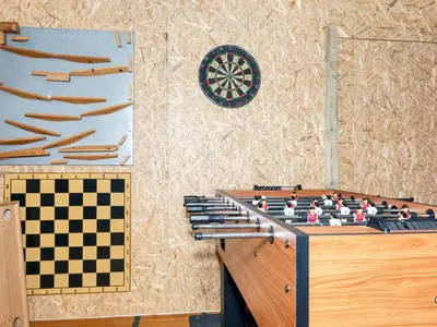 a chess board on a table next to a wall at 12 person holiday home in Roslev-By Traum in Roslev