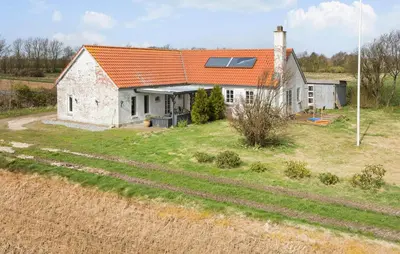 an old white house with an orange roof at 5 Bedroom Gorgeous Home In Thyholm in Thyholm