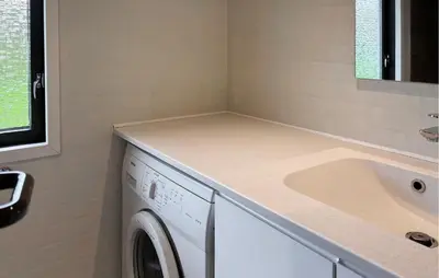 a laundry room with a washing machine and a sink at Amazing Home In Øster Assels With Wifi in Øster Assels