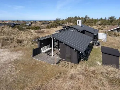 an overhead view of a house in a field at Holiday Home Annrike - 400m from the sea by Interhome in Saltum