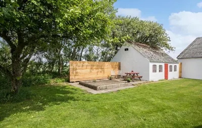 a backyard with a picnic table and a barn at 4 Bedroom Lovely Home In Ranum in Ranum