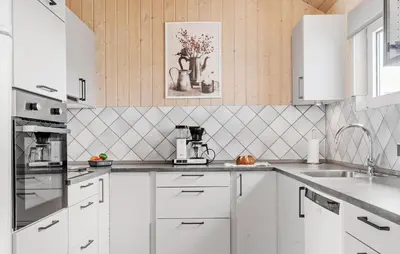 a kitchen with white cabinets and white appliances at Lovely Home In Thisted With Kitchen in Thisted