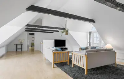 a living room with a couch and a tv at Nice Home In Roslev With Kitchen in Roslev