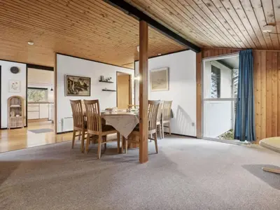 a dining room with a table and chairs at Holiday Home Suri - 200m to the fjord by Interhome in Thyholm