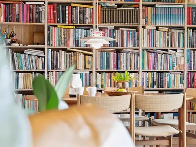 a library with shelves filled with books at Holiday Home Gidske - 300m from the sea by Interhome in Blokhus
