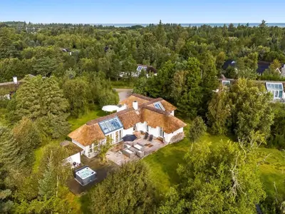an aerial view of a house in the woods at Holiday Home Verner - 900m from the sea by Interhome in Fjerritslev