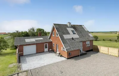 an image of a house with a garage at Nice Home In Thyholm With Wifi in Thyholm