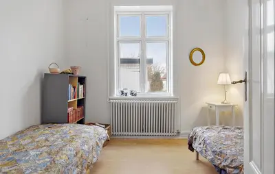 a bedroom with a bed and a window at Gorgeous Home In Løgstør in Løgstør