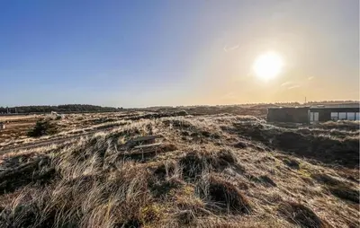 a grassy field with the sun in the sky at Gorgeous Home In Thisted With Wifi in Thisted