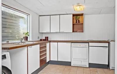 a kitchen with white cabinets and a dishwasher at 3 Bedroom Pet Friendly Home In Højslev in Højslev