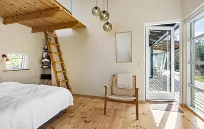 a bedroom with a bed and a ladder at Nice Home In Hurup Thy With Wifi in Sindrup