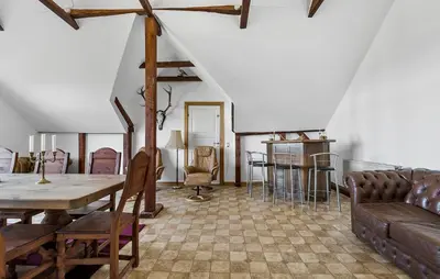 a living room with a table and chairs at Pet Friendly Apartment In Vestervig in Vestervig