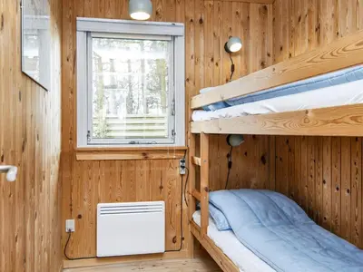 a room with two bunk beds and a window at 6 person holiday home in Struer-By Traum in Struer