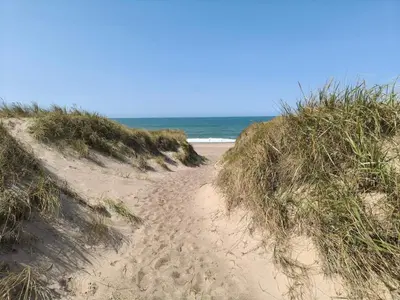 a sandy path leading to the ocean on a beach at 6 person holiday home in Vestervig-By Traum in Vestervig