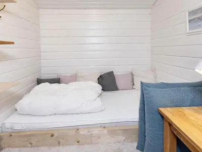 a bed in a room with white sheets and pillows at 5 person holiday home in Vesløs-By Traum in Øsløs