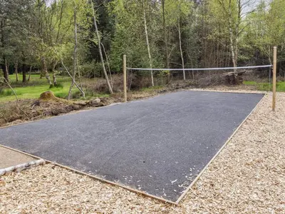 a basketball court in a park with a net at 5 star holiday home in Øster Assels-By Traum in Øster Assels