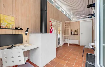 a room with a desk and a computer in a room at Holiday Home Hurup Thy Ij-1982 in Sønder Ydby