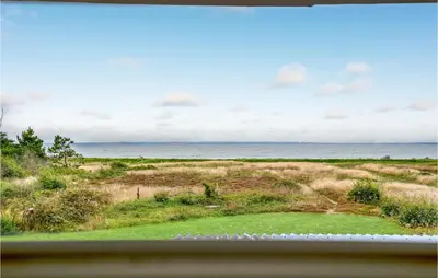 a view of the ocean from a window at Holiday Home Hurup Thy Ij-1982 in Sønder Ydby