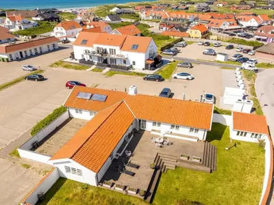 an aerial view of a house with an orange roof at Holiday Home Jeppe - 200m from the sea by Interhome in Blokhus