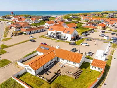an aerial view of a large house with orange roofs at Holiday Home Jeppe - 200m from the sea by Interhome in Blokhus