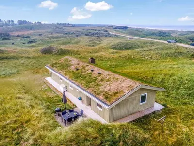 an overhead view of a house with a grass roof at Holiday Home Pinja - 400m from the sea by Interhome in Løkken