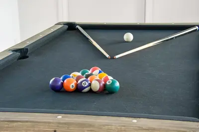 a pool table with a bunch of balls on it at Pool house with beautiful view by the sea - SJ650 in Lemvig