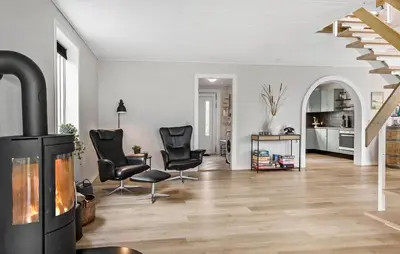a living room with chairs and a fireplace at Stunning Home In Spøttrup With Wifi in Spottrup