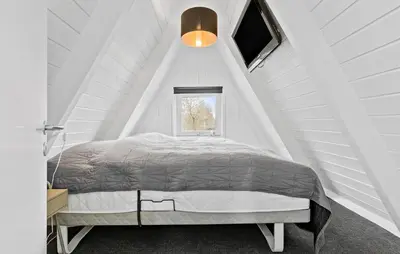 a white bedroom with a bed in a room with a window at Awesome Home In Farsø With Wifi in Farsø