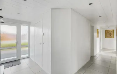 an empty hallway with white walls and a window at Beautiful Home In Thisted With Wifi in Thisted
