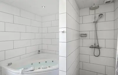 a white bathroom with a tub and a shower at Beautiful Home In Thisted With Wifi in Thisted