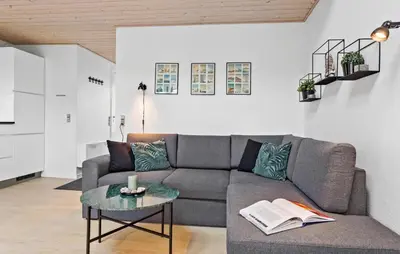 a living room with a couch and a table at Amazing Apartment In Vestervig in Vestervig