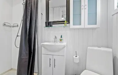 a white bathroom with a sink and a toilet at Amazing Apartment In Vestervig in Vestervig