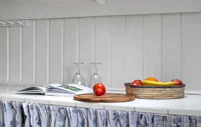a table with a basket of fruit and a book at Cozy Home In Vestervig With Wifi in Vestervig