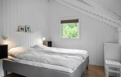 a bed in a white room with a window at Cozy Home In Vestervig With Wifi in Vestervig