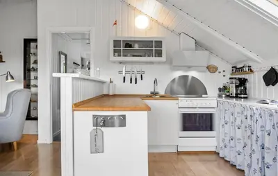 a kitchen with white cabinets and a counter top at Cozy Home In Vestervig With Wifi in Vestervig