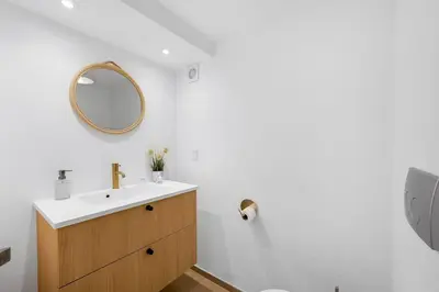 a bathroom with a sink and a mirror at Nyd den skønne natur ved hav og fjord in Thyborøn