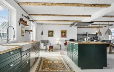 a kitchen with green cabinets and a living room at Lovely Home In Thisted With Wifi in Thisted