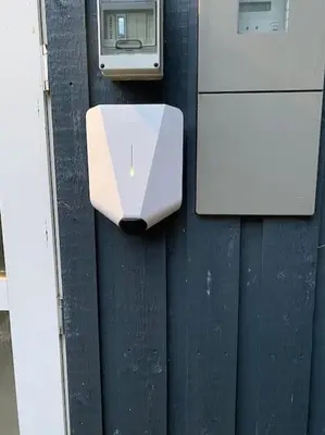 a white appliance on the side of a wall at Pool summerhouse in Saltum near Blokhus in Saltum